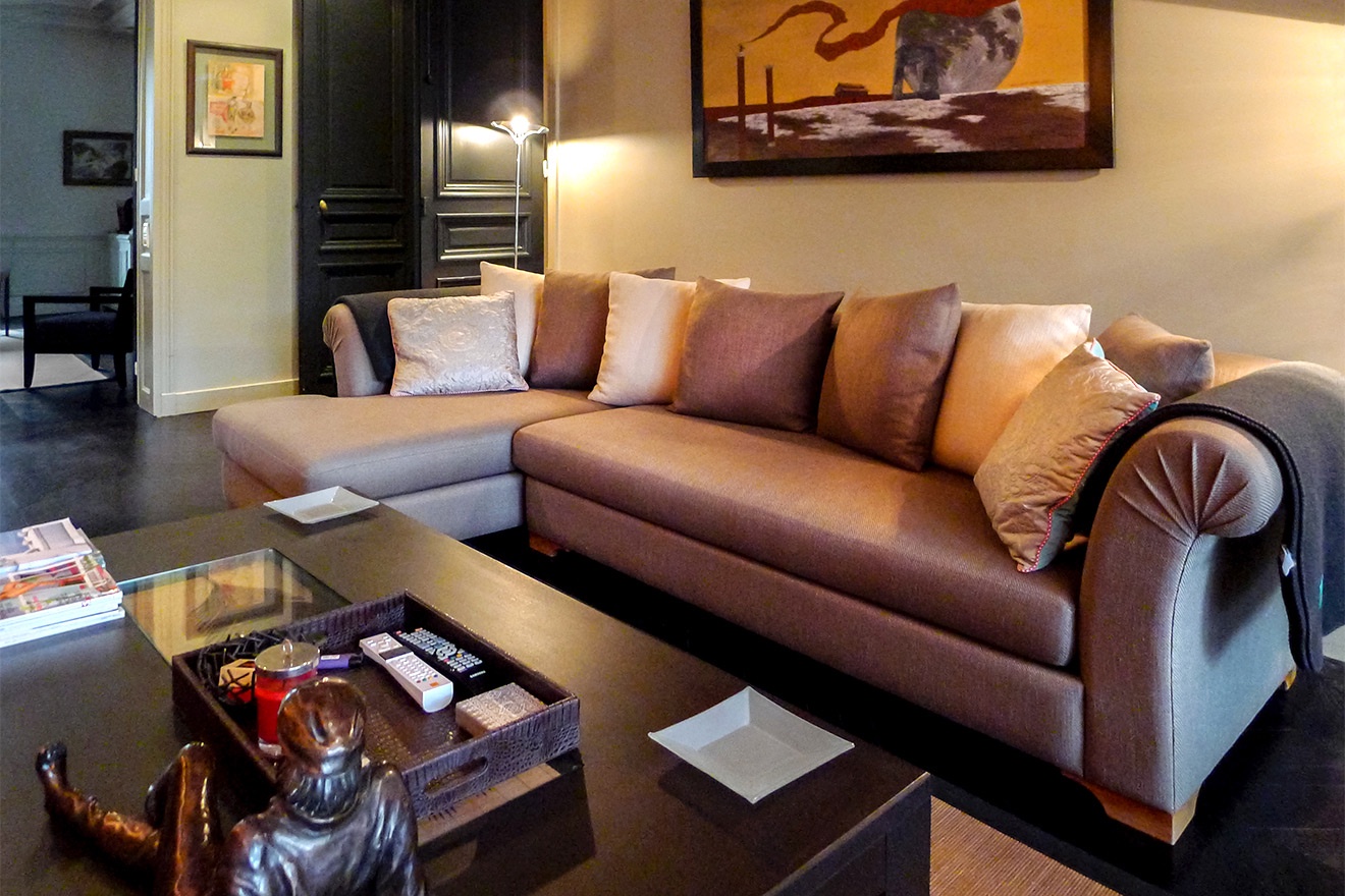 Relax on the comfortable designer sofa in the den.