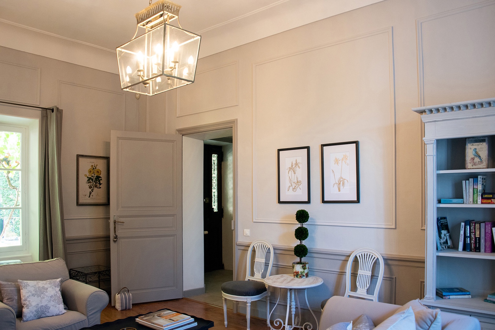 Villa entrance leads to elegant living room.