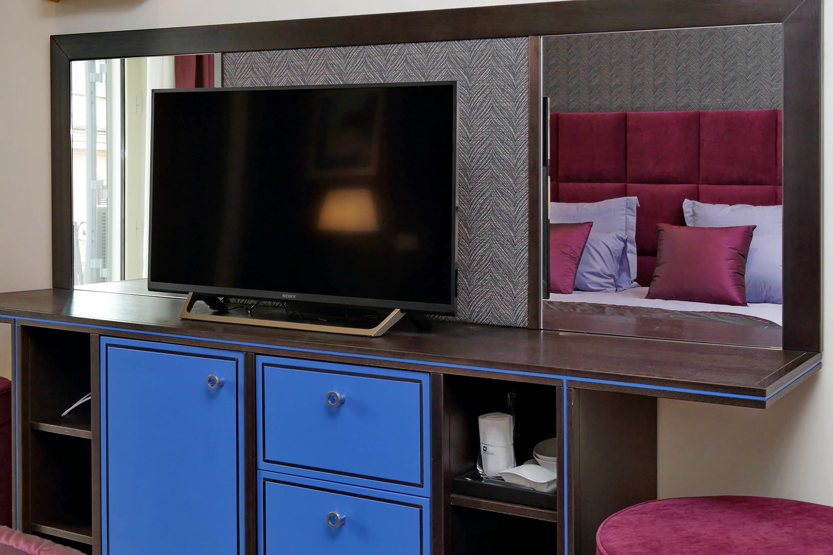 Large TV opposite the bed in bedroom 1.