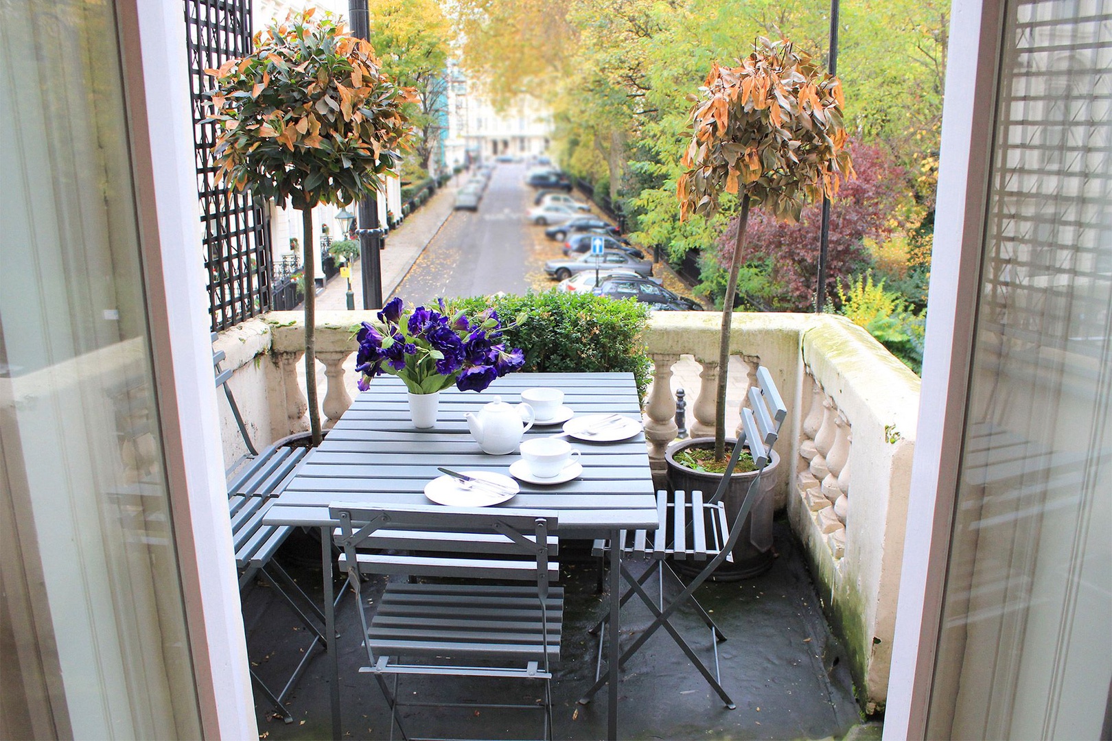 Charming balcony with garden views located off living room