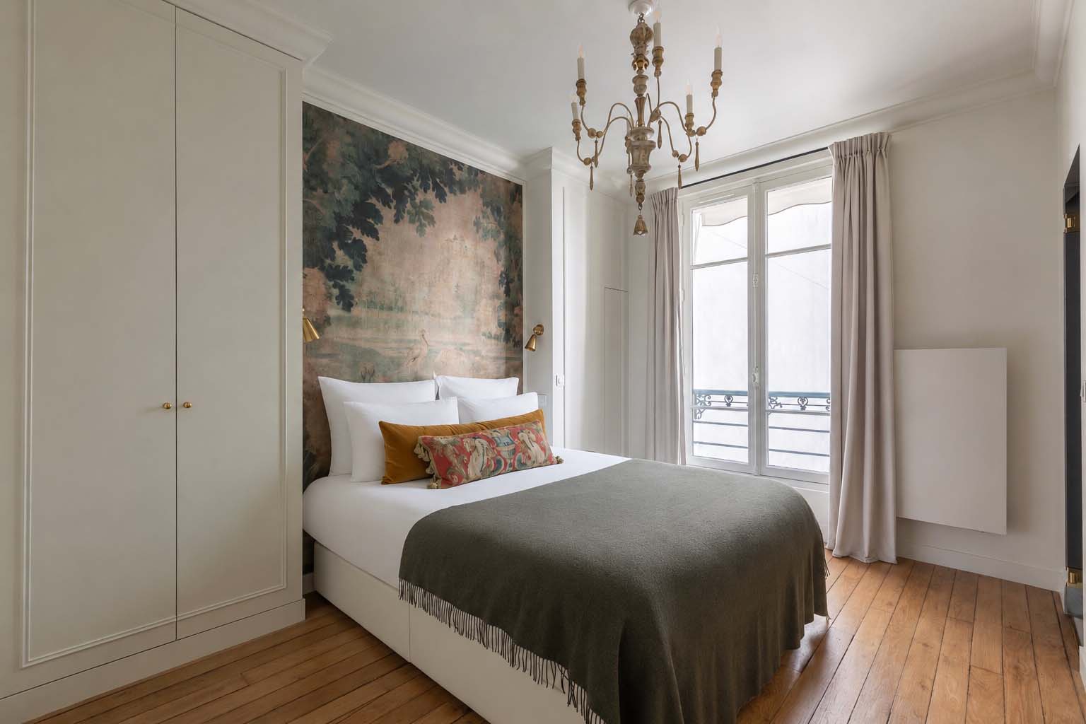 Beautiful bedroom 1 even has a glimpse of the Eiffel Tower.