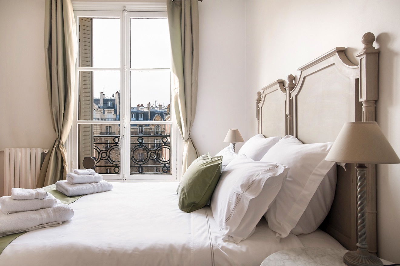 Bedroom 1 overlooks a courtyard for a good night's rest.