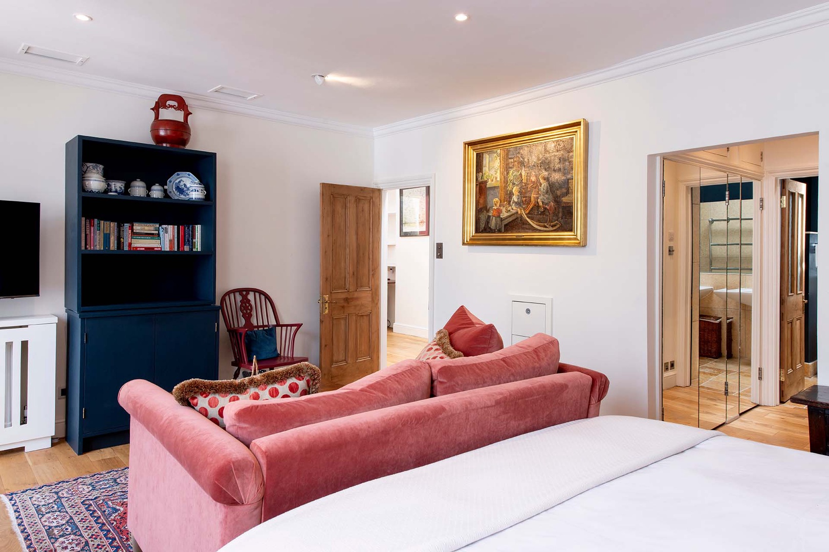 Sofa creates a cozy area in bedroom 1 for reading or watching TV.