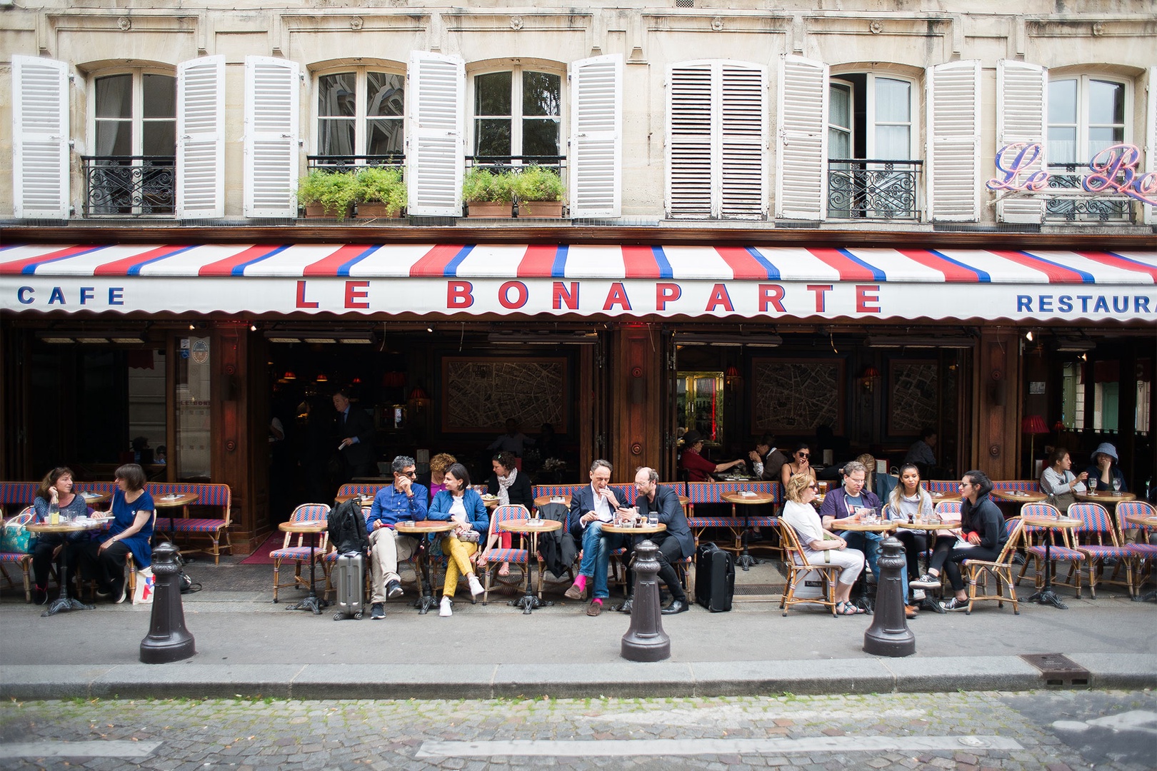 Spend a lazy afternoon people watching at a local café.