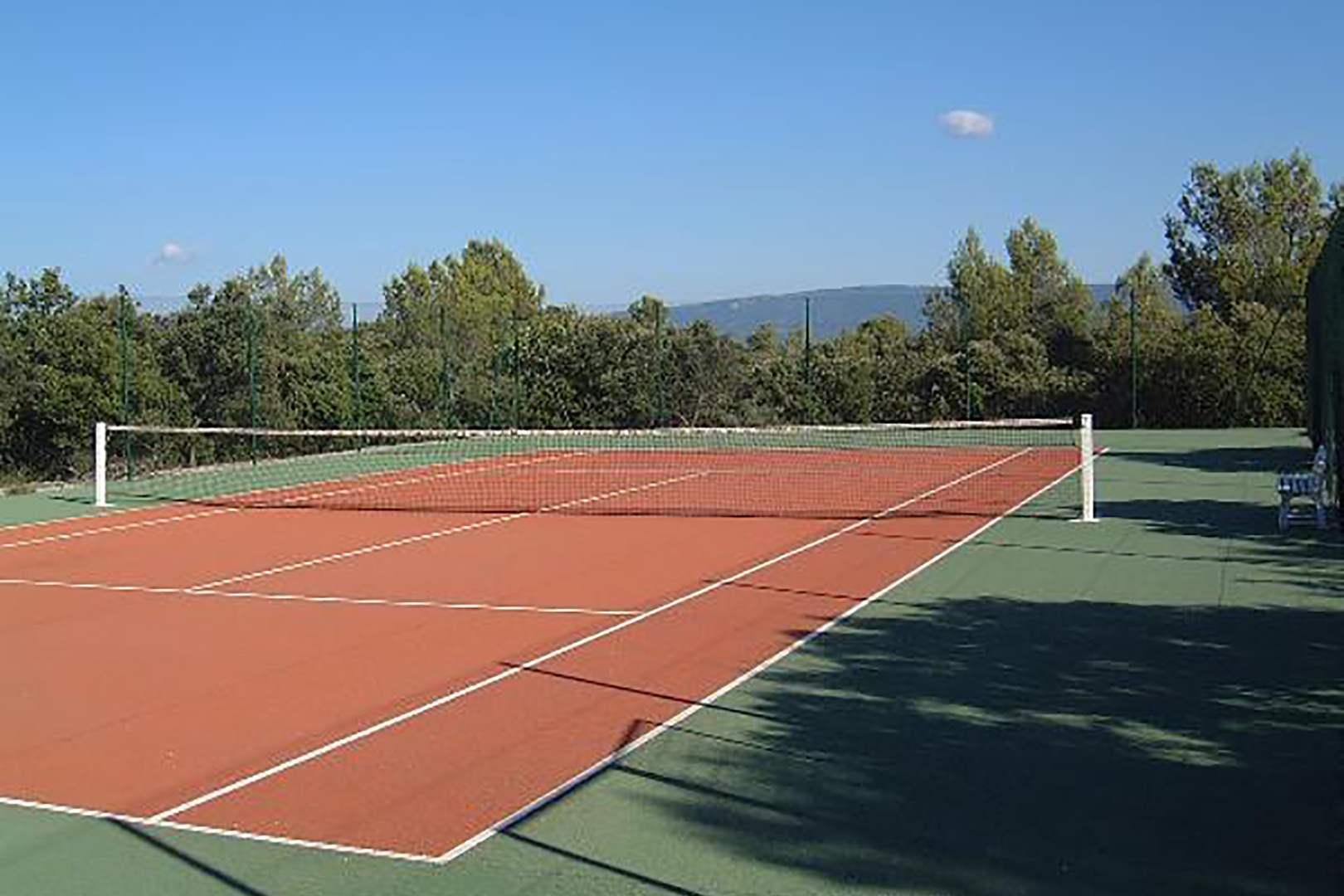 Private tennis court with synthetic quick dry surface