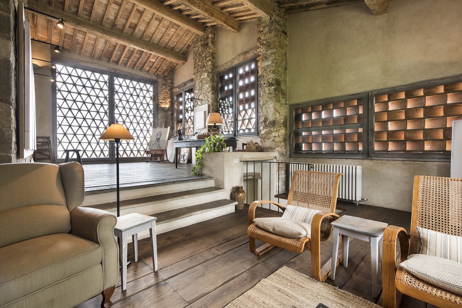 Planked wood floors and preserved Tuscan brickwork add to the charm of the Coratina Villa