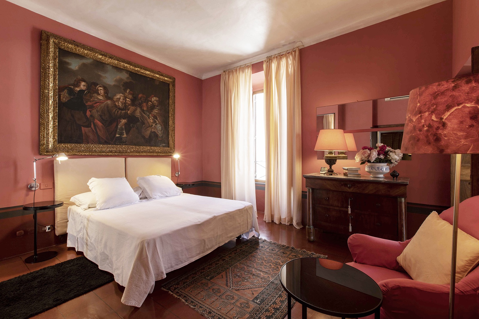 Handsome Pompeii red walls in bedroom 2. The single beds are combinable.