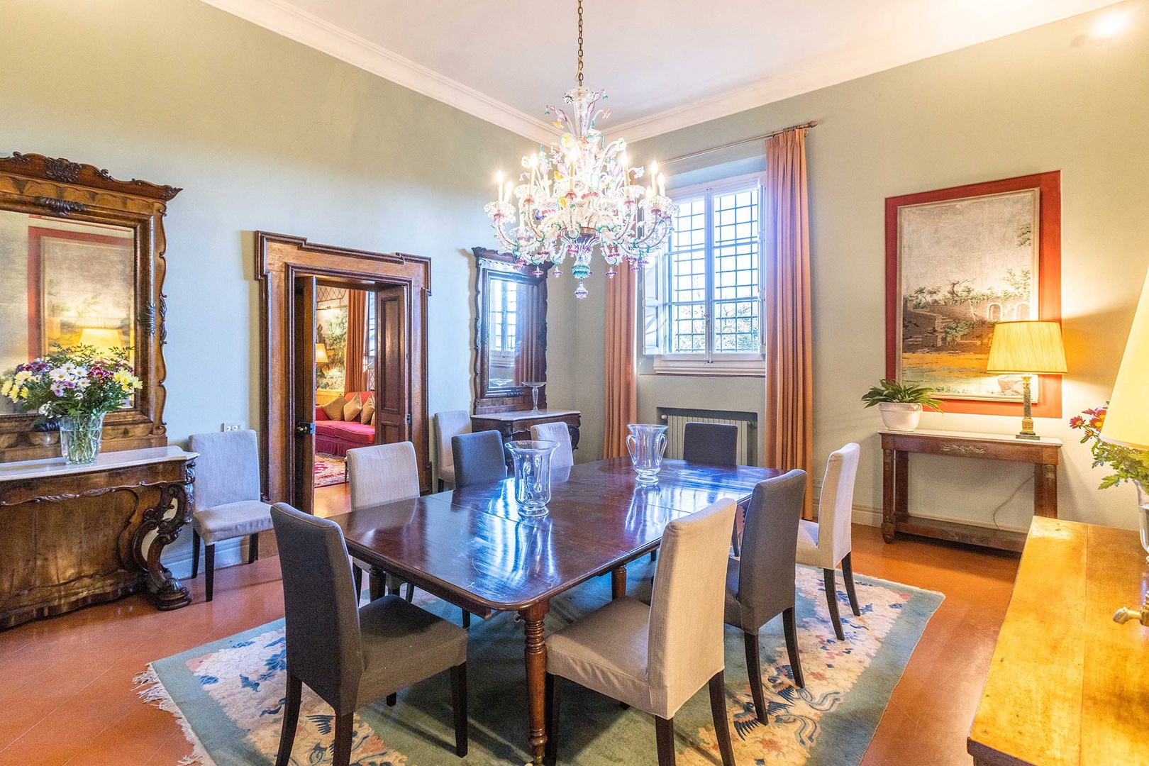 Dine in style in the elegant dining room with gorgeous Venetian glass chandelier.