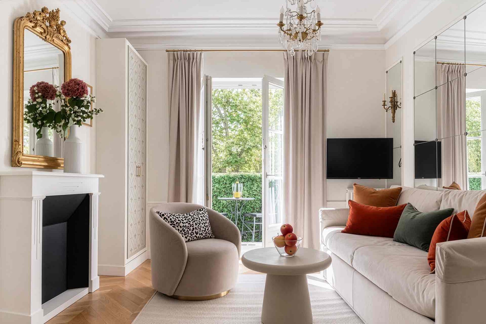 Step out to the balcony overlooking the tree-lined boulevard.