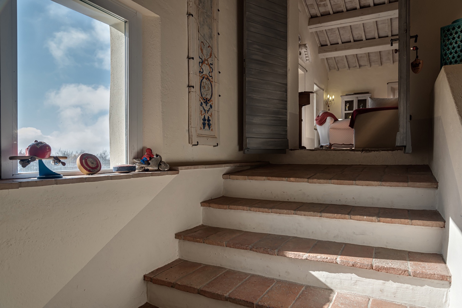 Stairs up to the living room from the first floor of the main house.