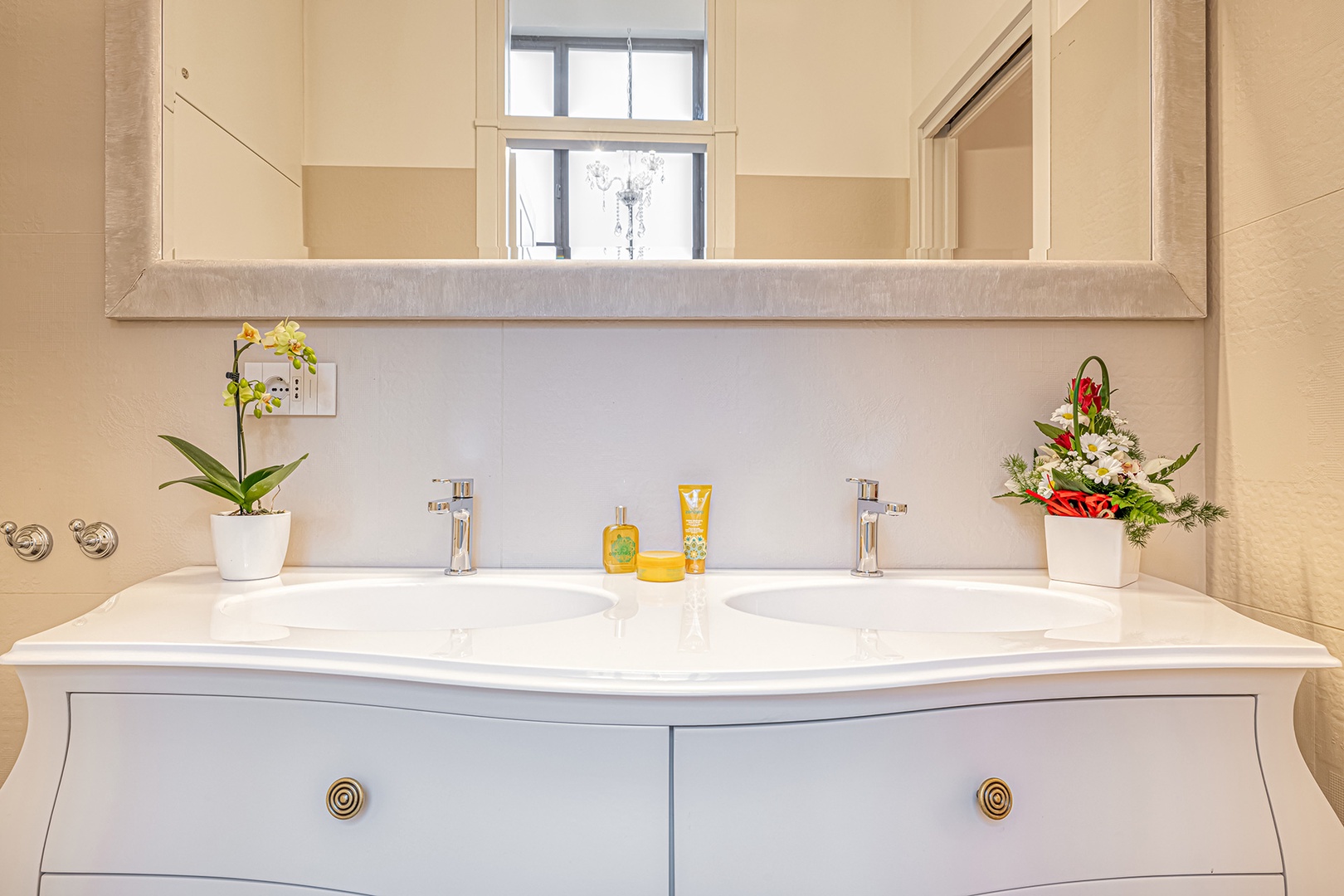 Bathroom 1 has a double sink and large shower