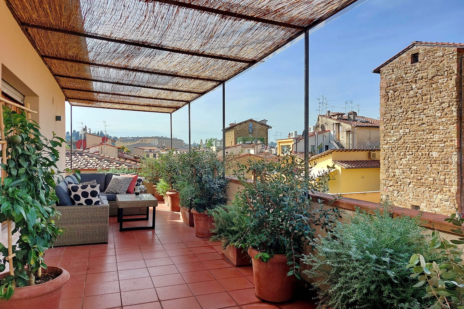 The covered terrace provides shade and privacy.