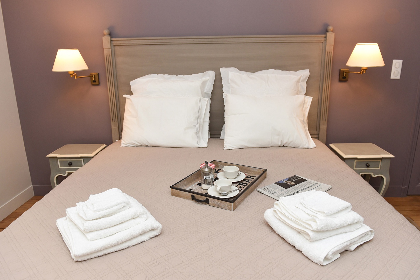 Relax in the comfortable bed after a fun day of sightseeing in Paris.