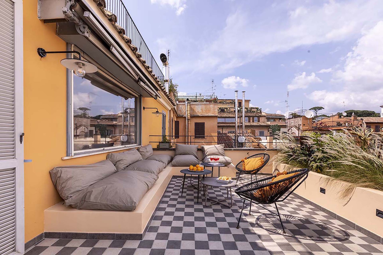 A retractable awning provides shade for the terrace.
