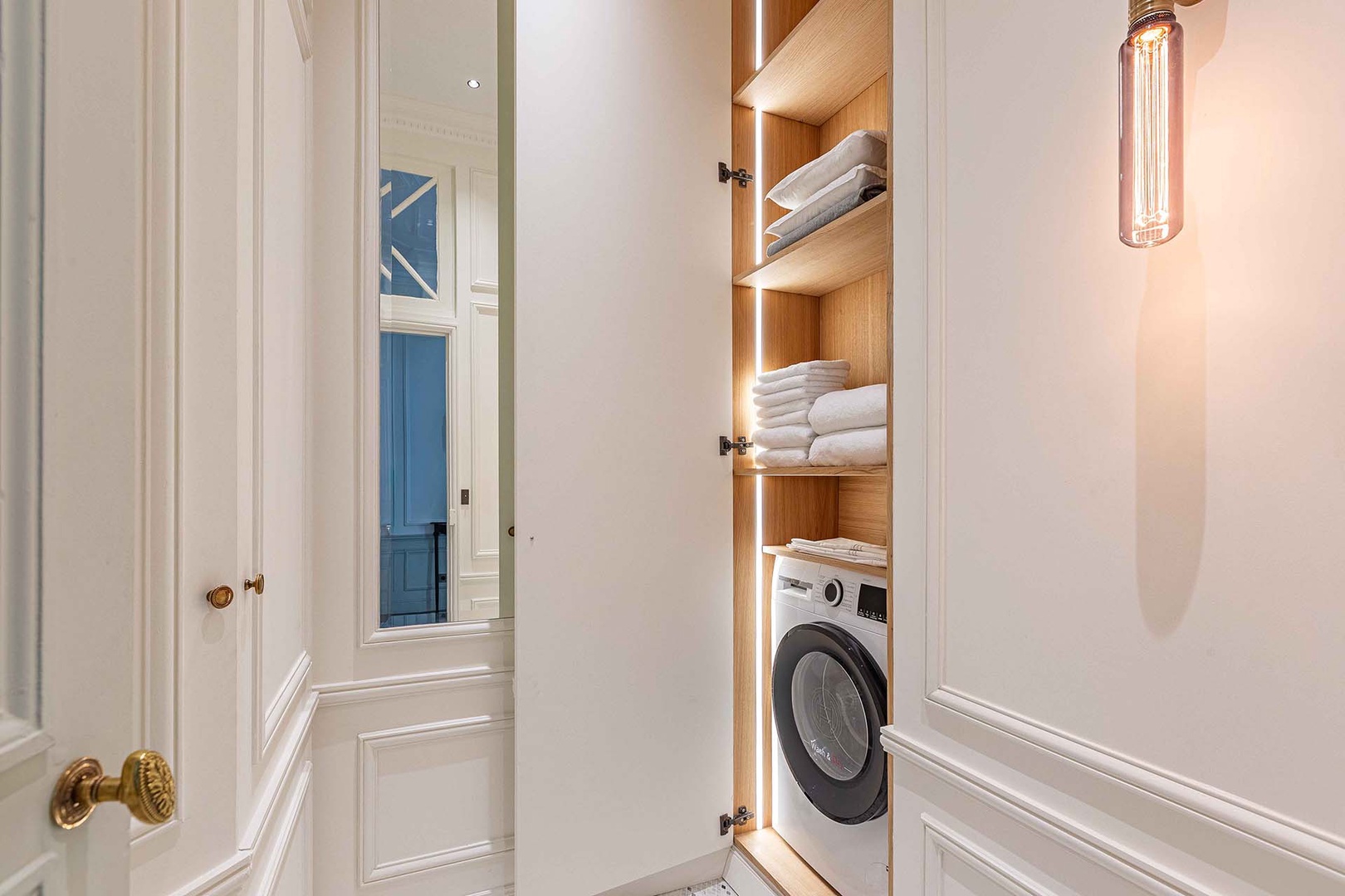 Spacious laundry room with washer/dryer combo.