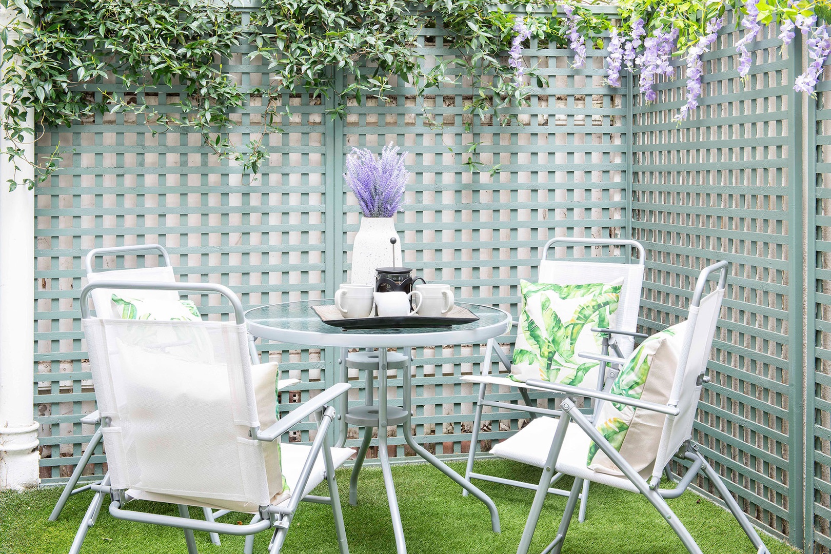 Relax outdoors on the patio with table for dining al fresco.