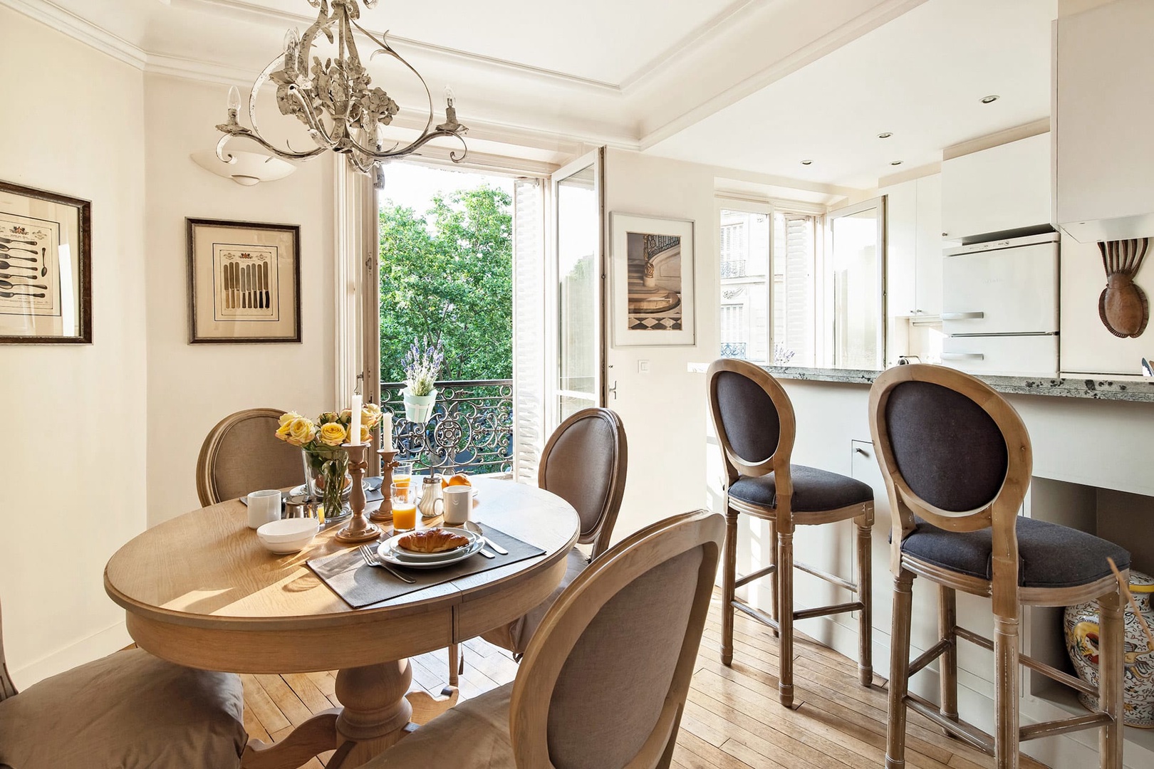 The dining table is conveniently located next to the kitchen.