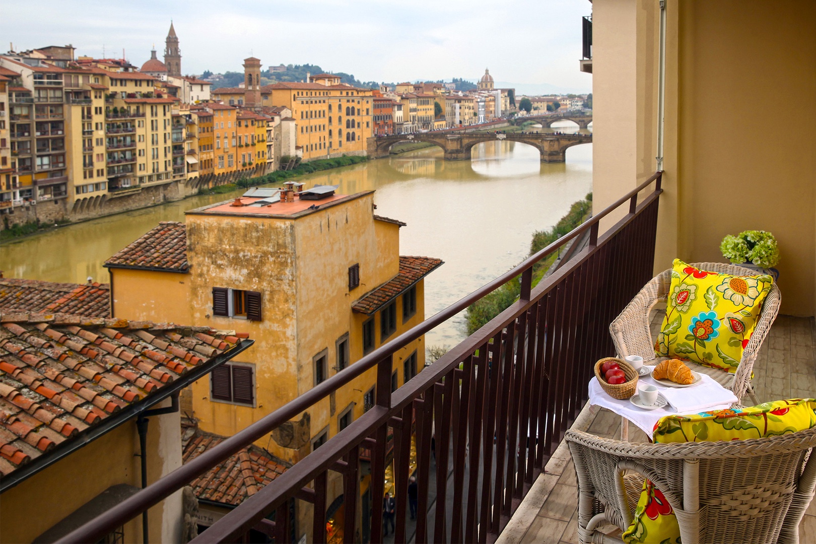 Step out onto the terrace and drink in the views. The narrow terrace has a table and two chairs.