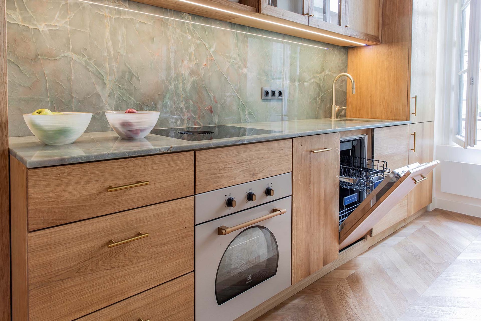 Dishwasher hidden behind beautiful wood cabinets.