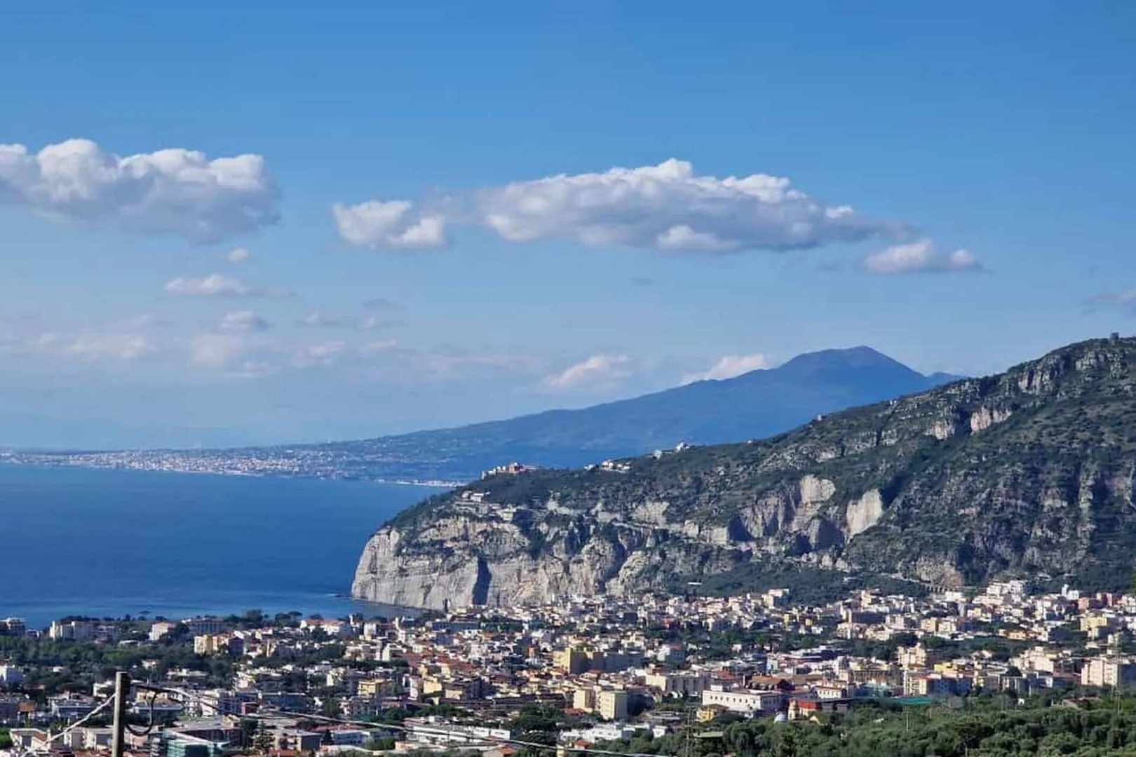 See Mount Vesuvius soaring from the upper terrace.