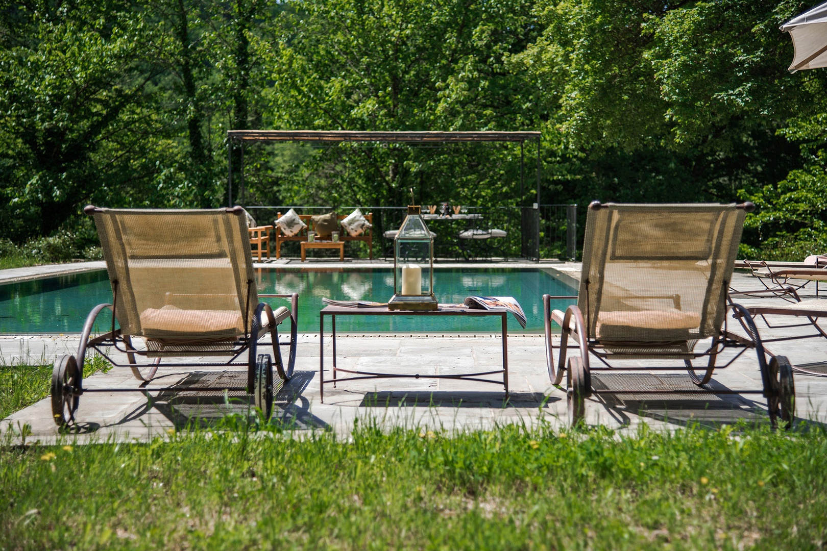Beautiful swimming pool with plenty of lounge chairs at Villa Felice.