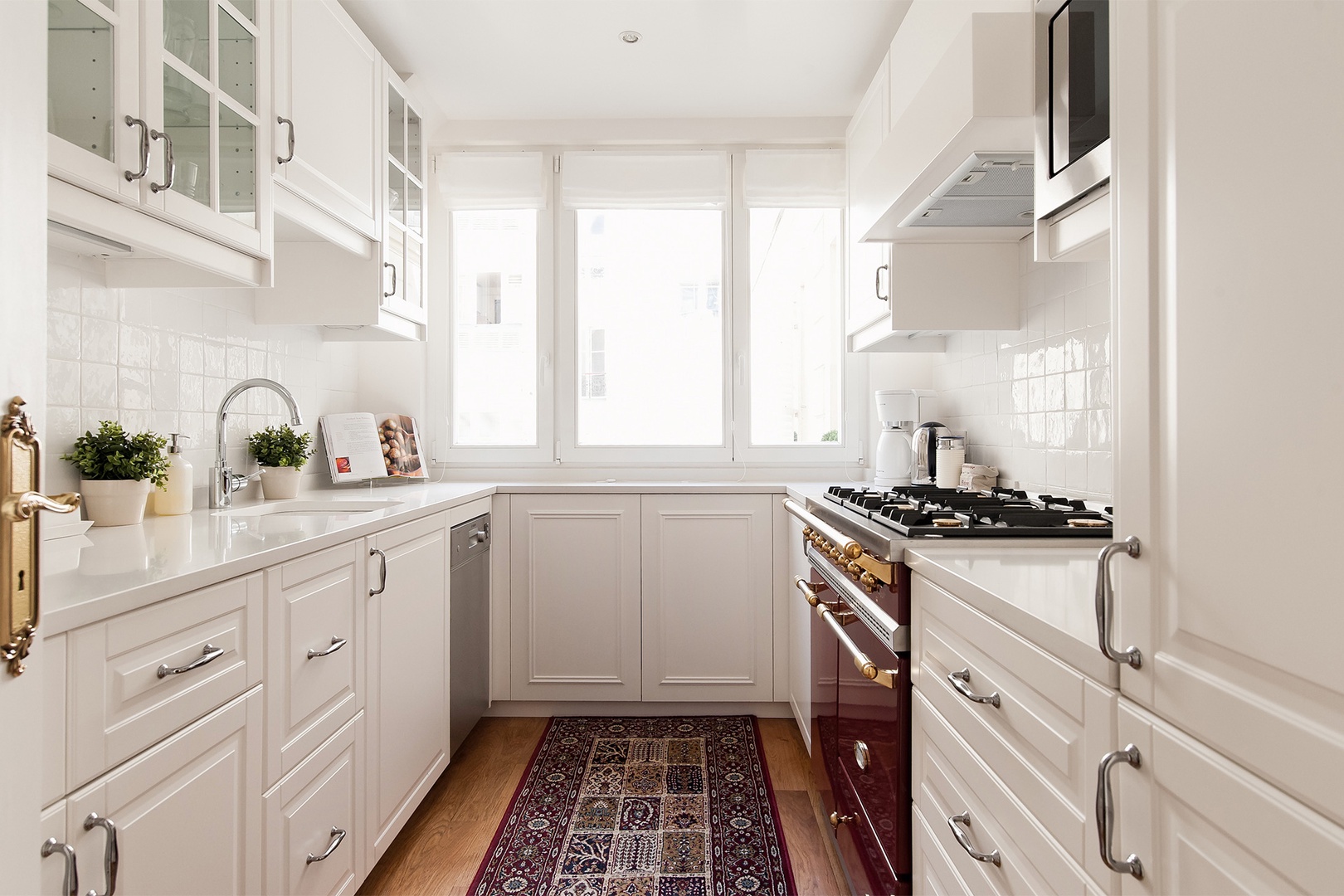 The kitchen comes with plenty of storage cabinets.