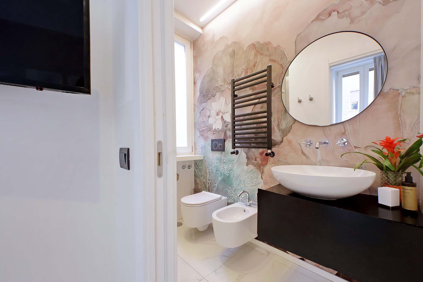 Bathroom 1 with shower, toilet and sink is en suite to bedroom 1.