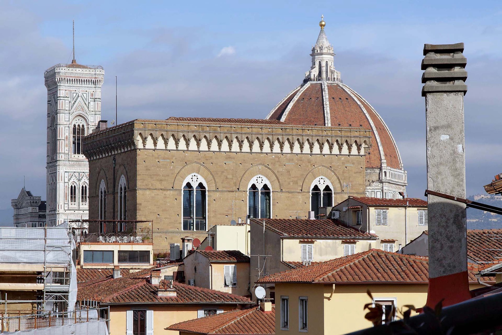 Florence's iconic Duomo dominates the historic skyline, featuring Brunelleschi's famous dome and Giotto's bell tower among terracotta rooftops.
