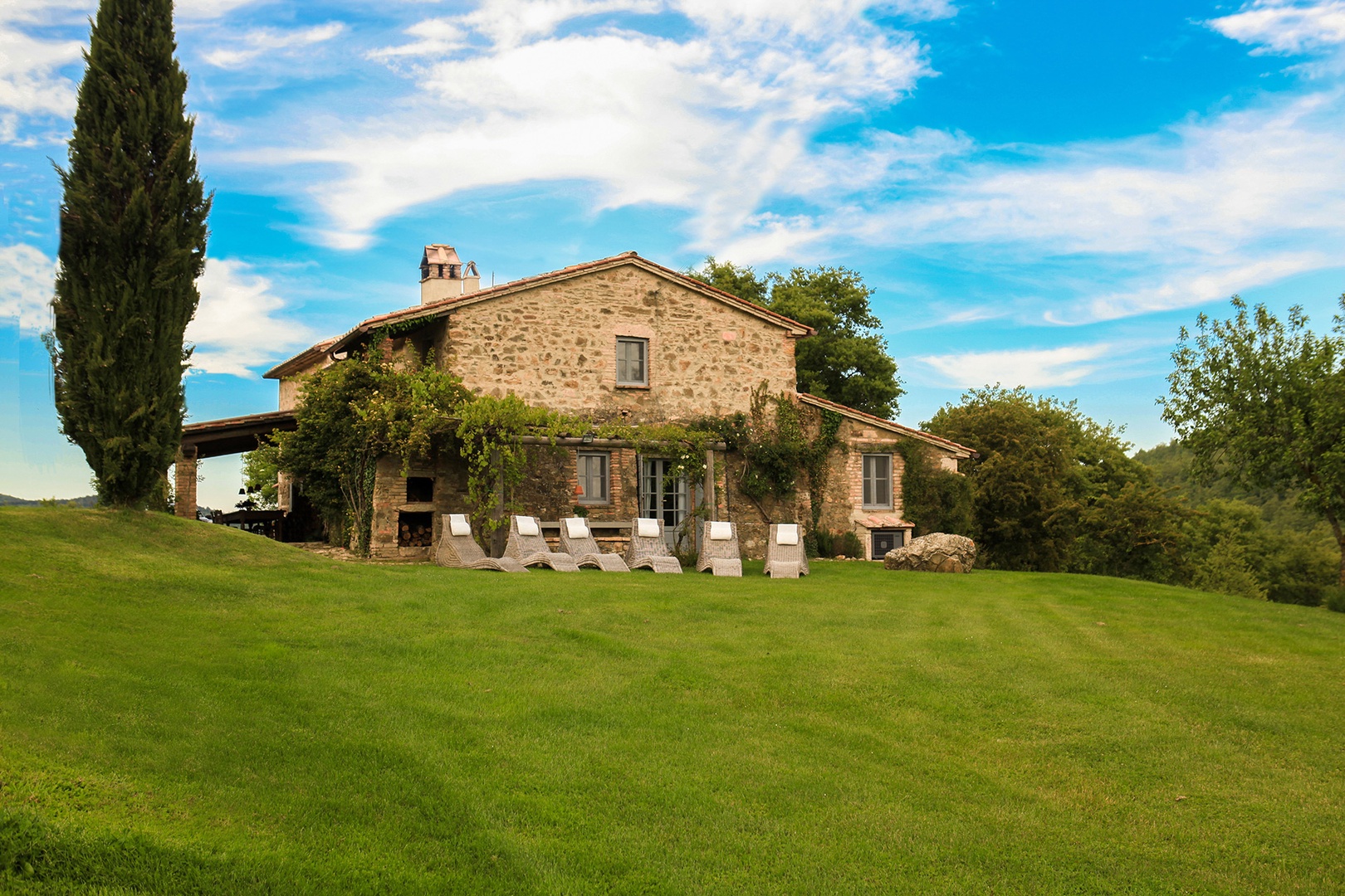 An expansive vista to enjoy from the comfort of the lounge chairs on the lawn of Riposo Verde Villa.