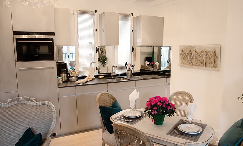 Tall windows create a light-filled setting in the kitchen.