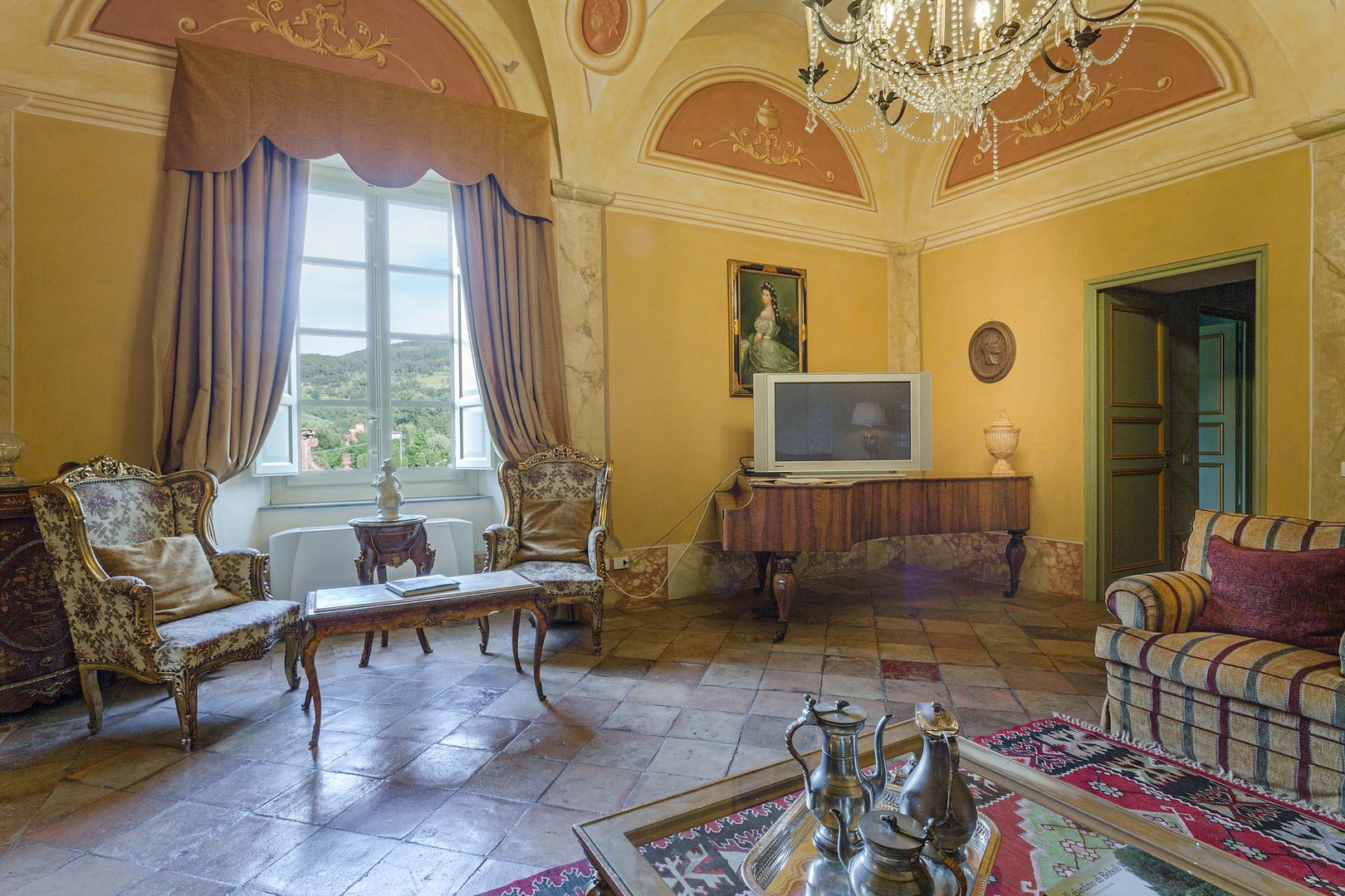 Original tiled floors adorn the halls of the villa