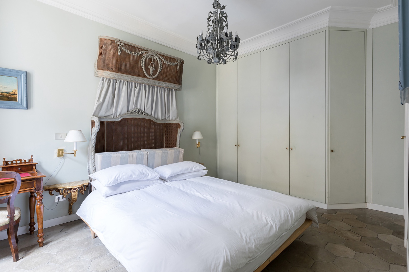 Beautiful antique wicker bedstead in bedroom 1 with an en suite bathroom