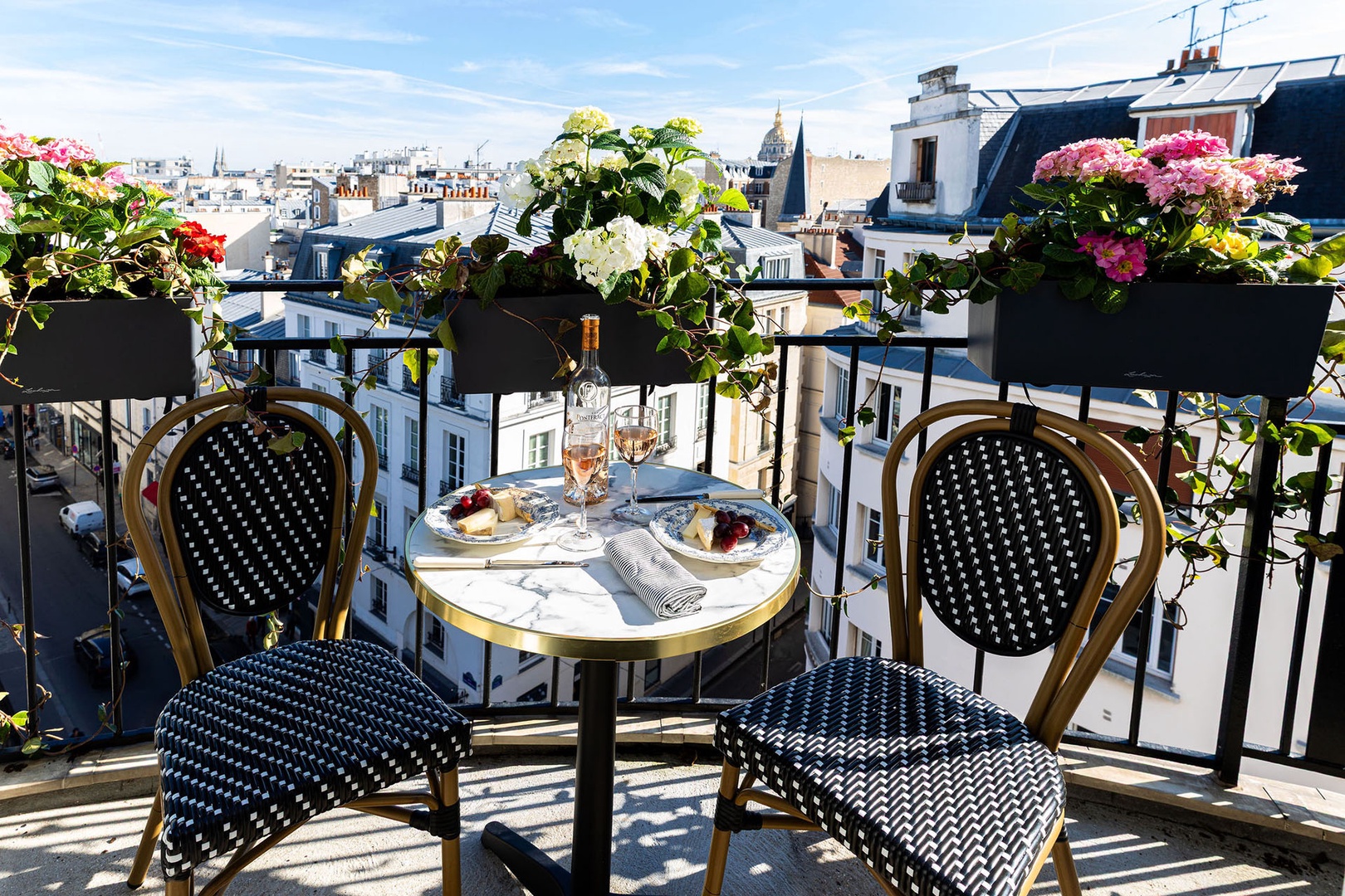 Dine indoors or step outside to find another charming balcony off the dining area.