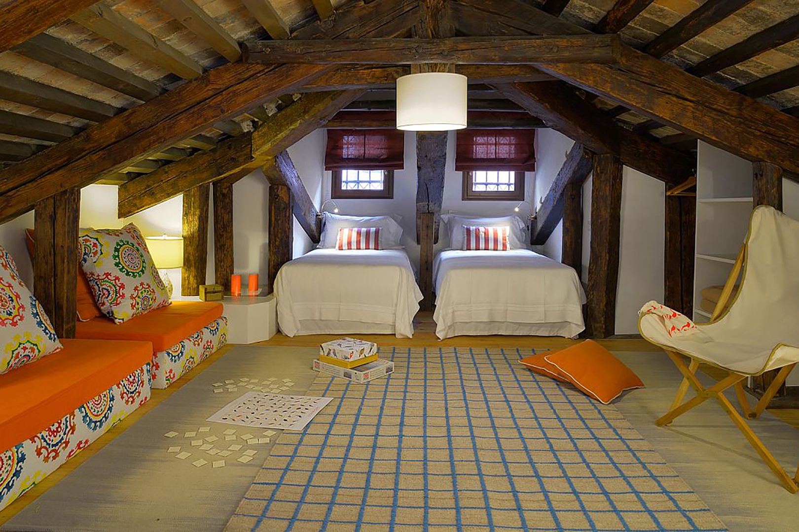 Attic bedroom. Bright highlights will appeal to children who can best navigate the low ceiling.