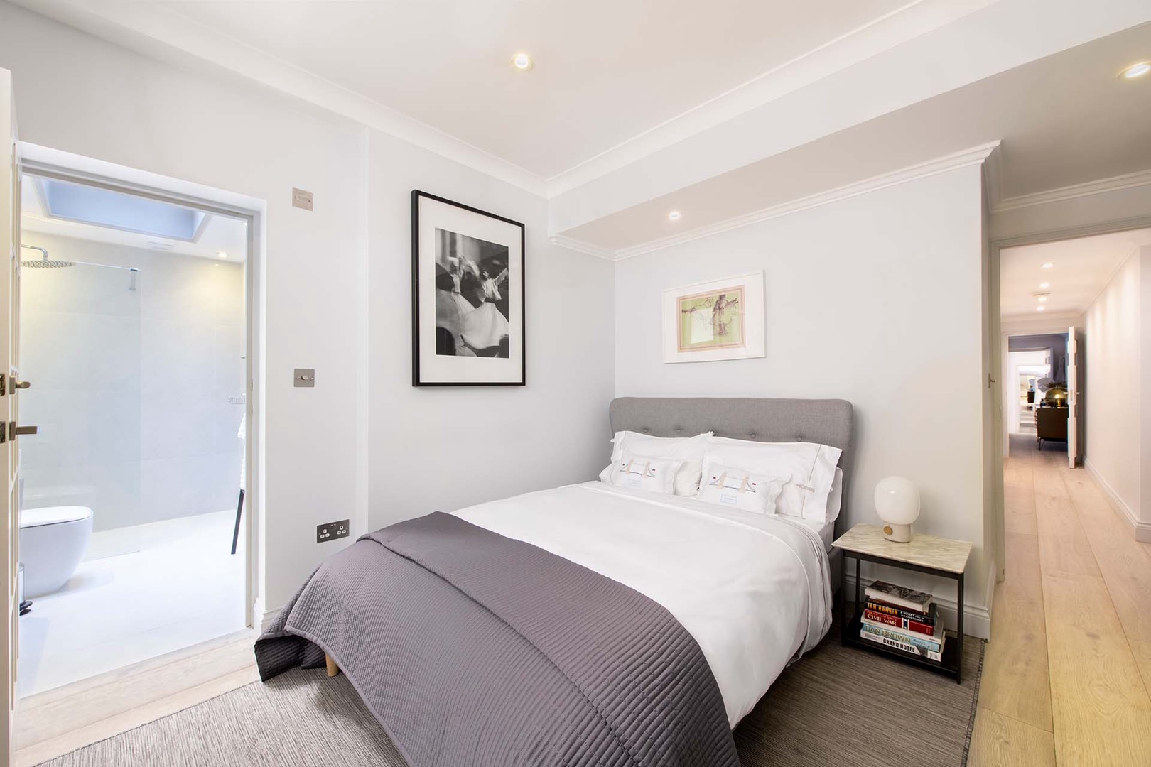 Bedroom 2 has a serene design and en suite bathroom.