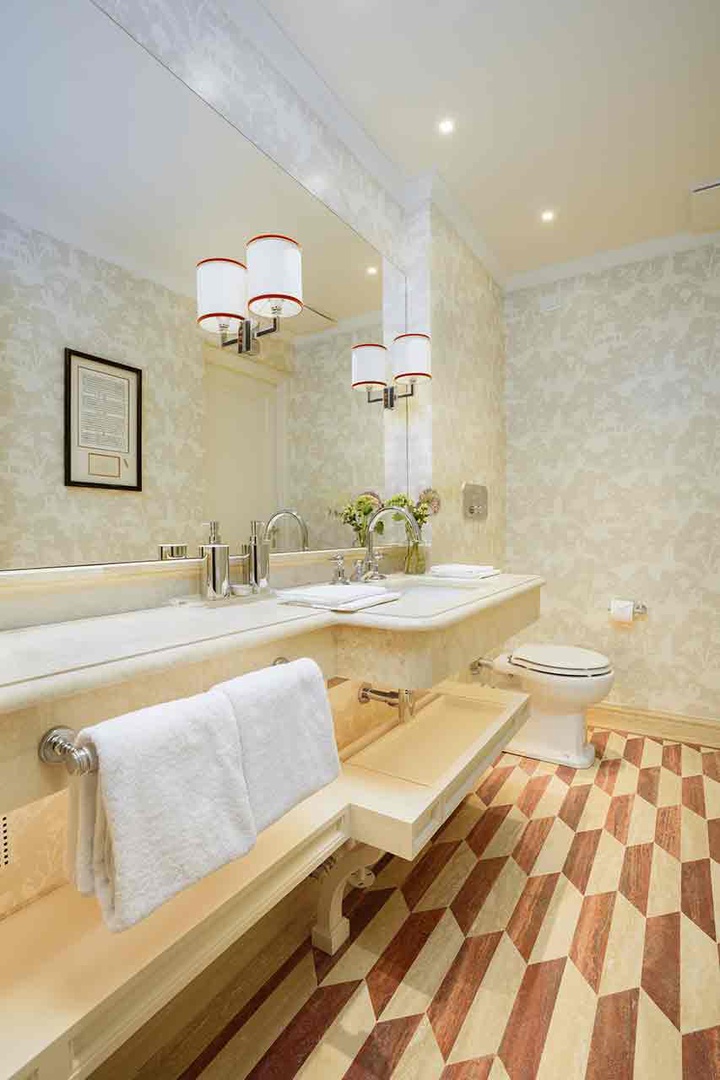 Half Bath with toilet and sink just off the living room.