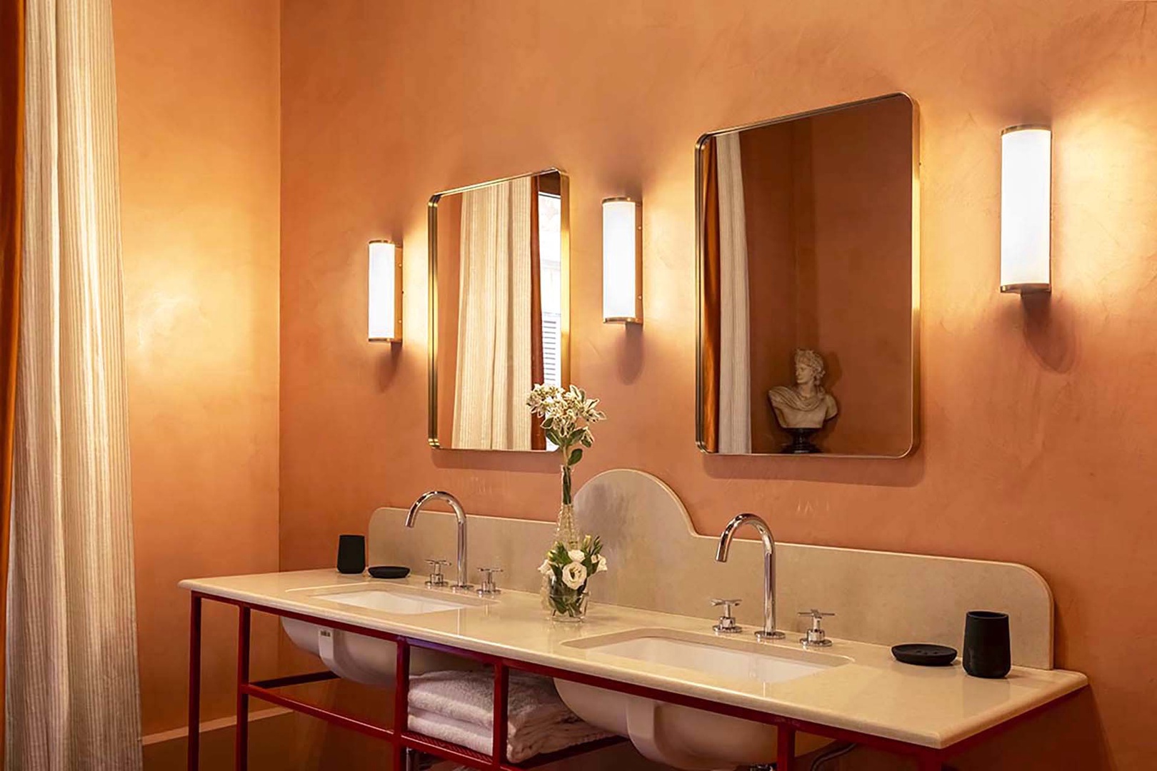 Double sinks and warm tones in en suite.