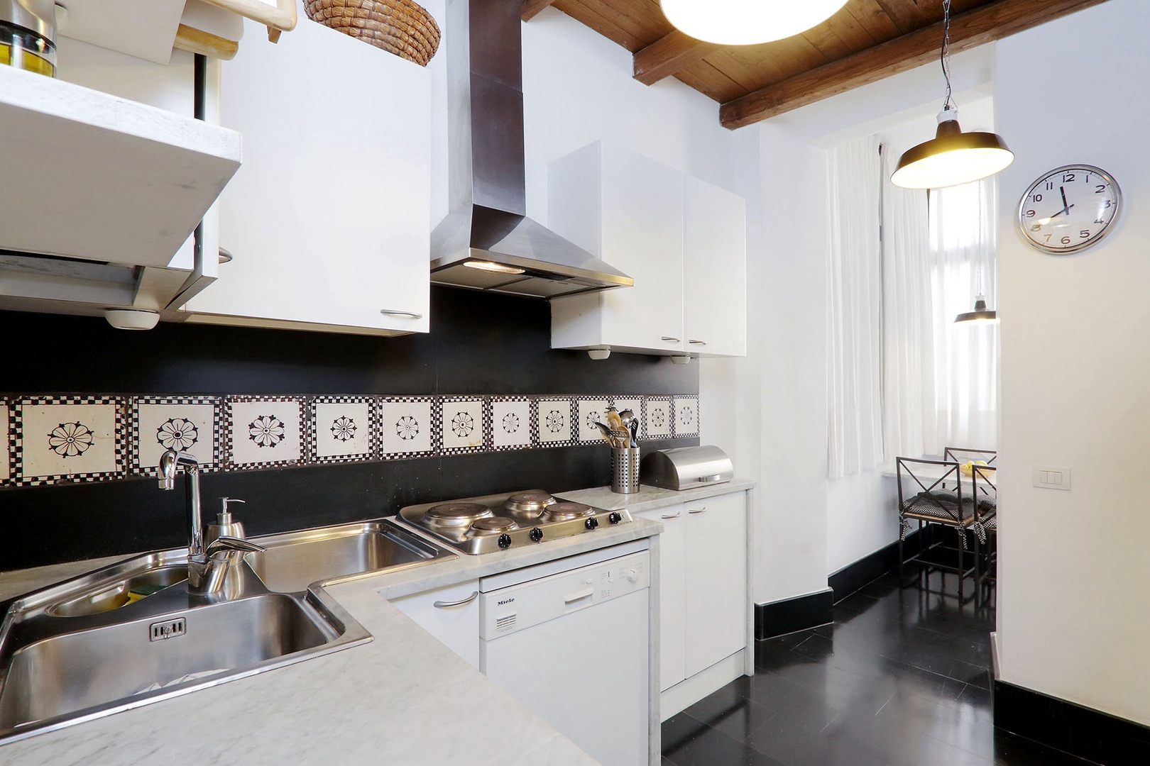 This full and separate kitchen will support simple or elaborate cooking.