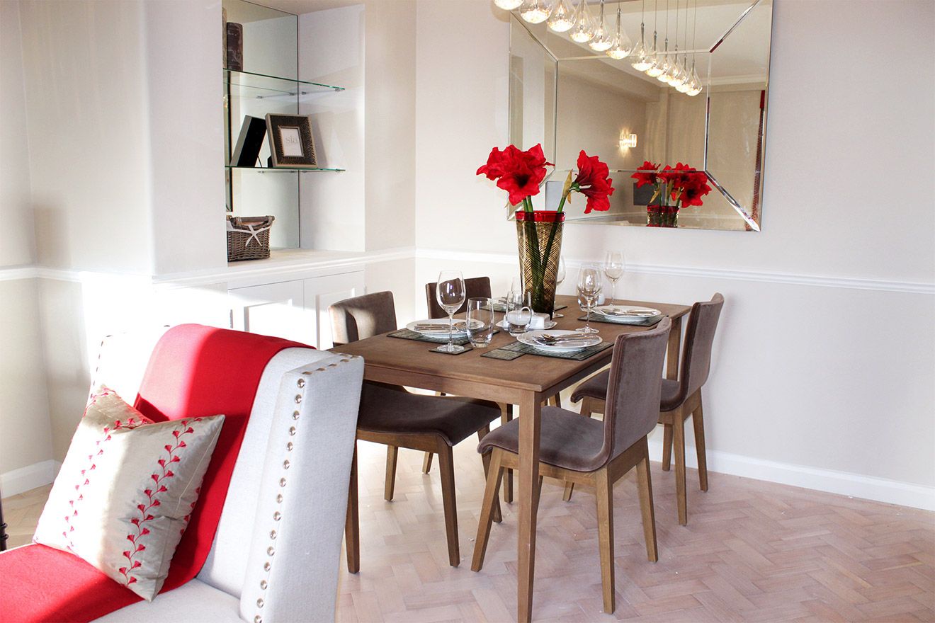 Dining area with wooden table seats four comfortably