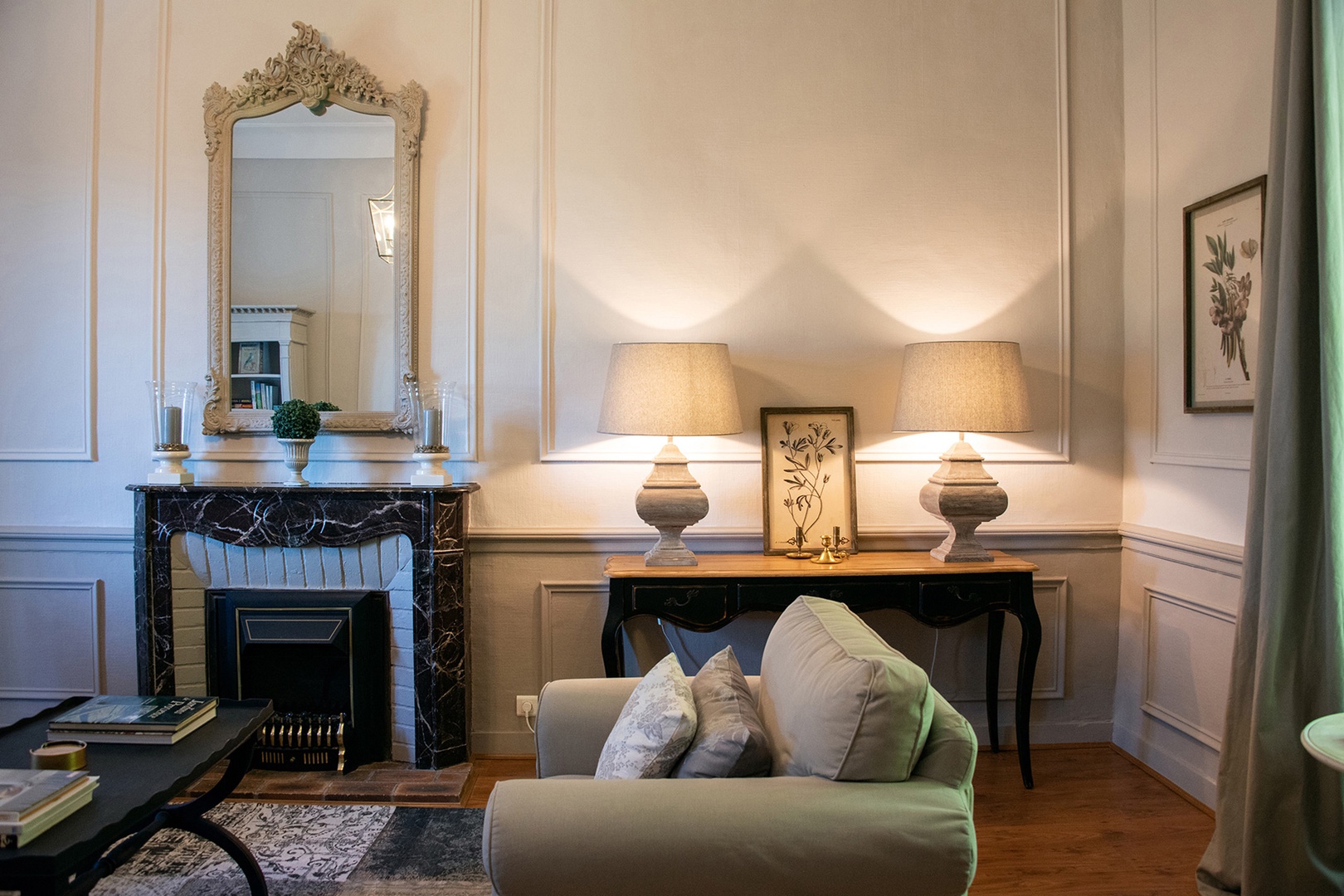 Original marble fireplace mantle in living room.