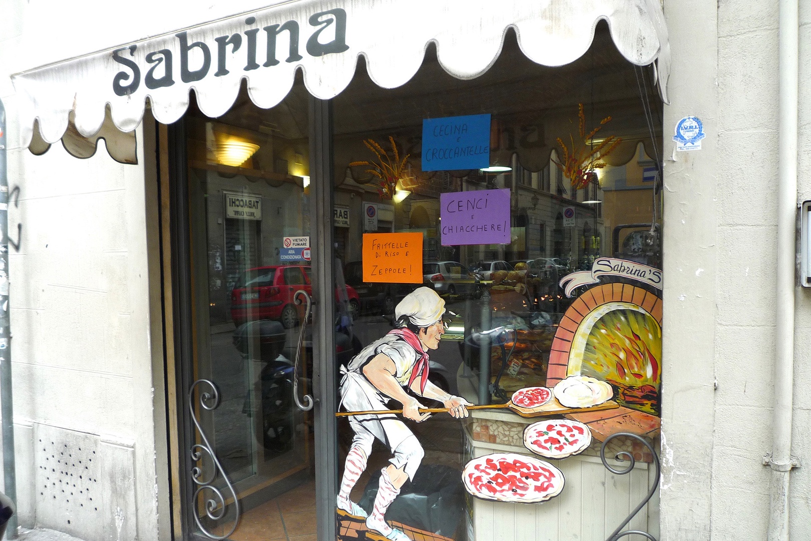The same bakery at the corner that sells pastries also has good pizza.