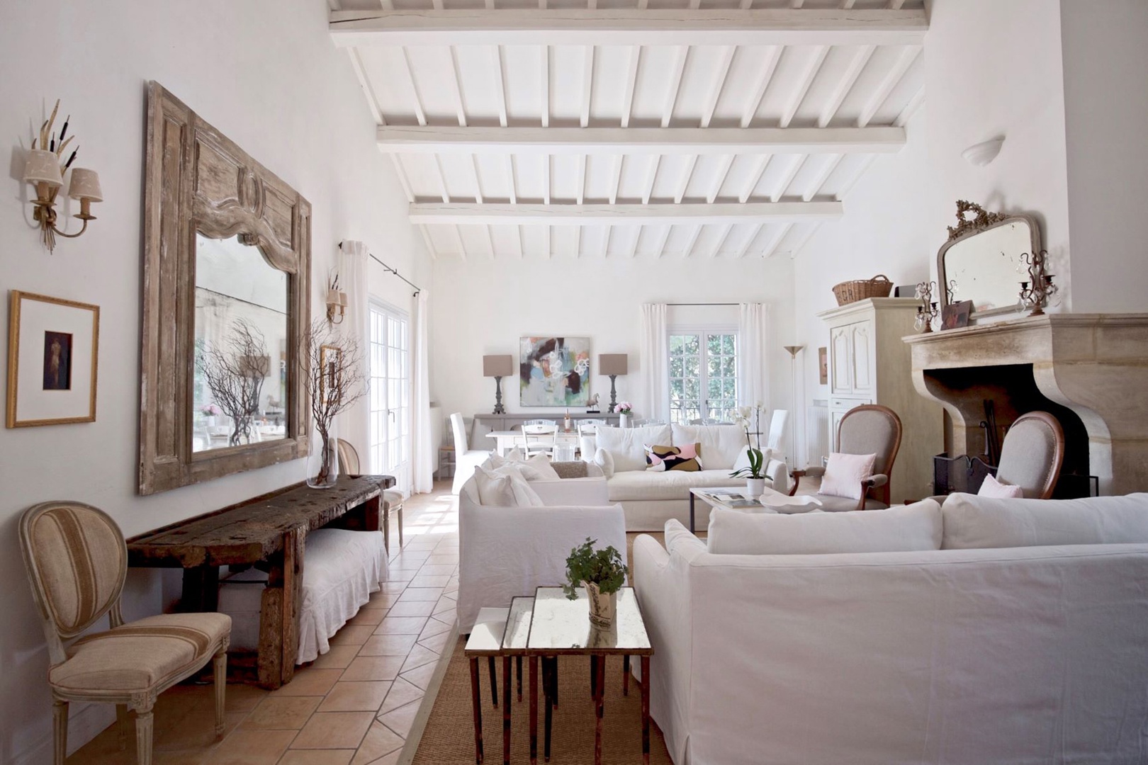 Spacious living room with soaring ceiling and dining area