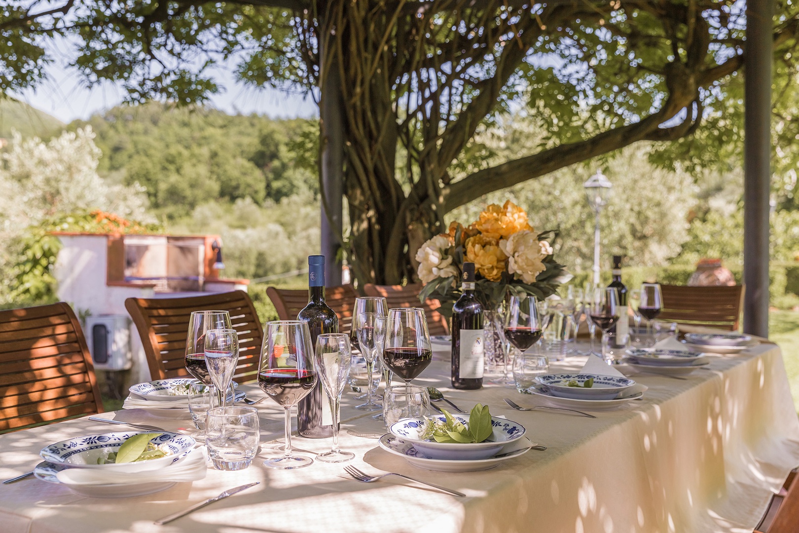 Just below the pool is a generously sized gazebo with a dining table.