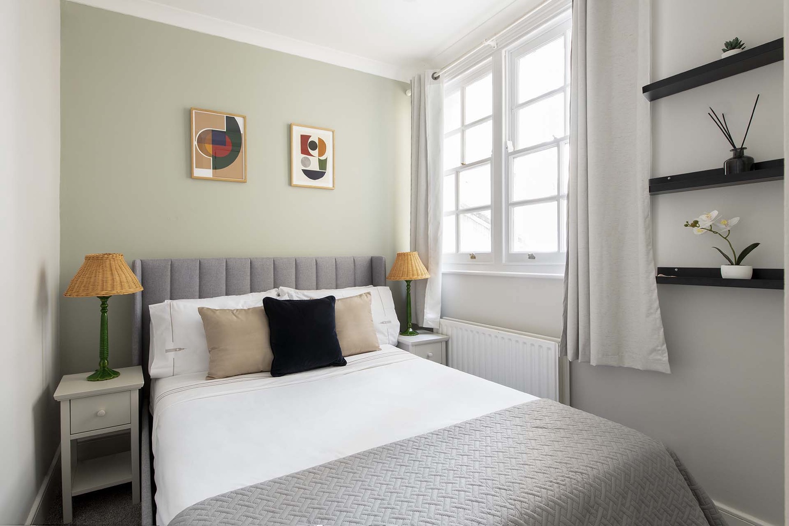 Charming bedroom 3 with large window.