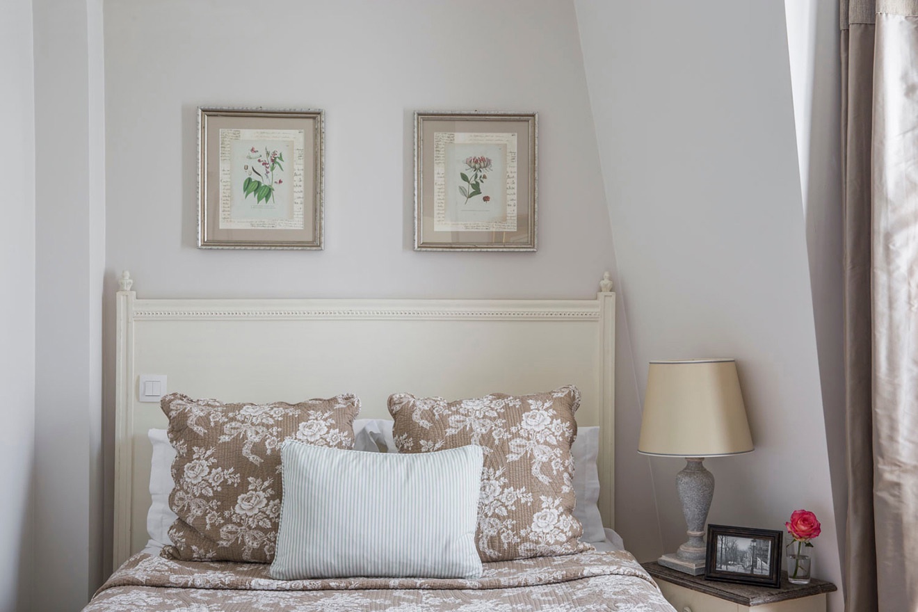 Bedroom 2 is tastefully decorated French-style.