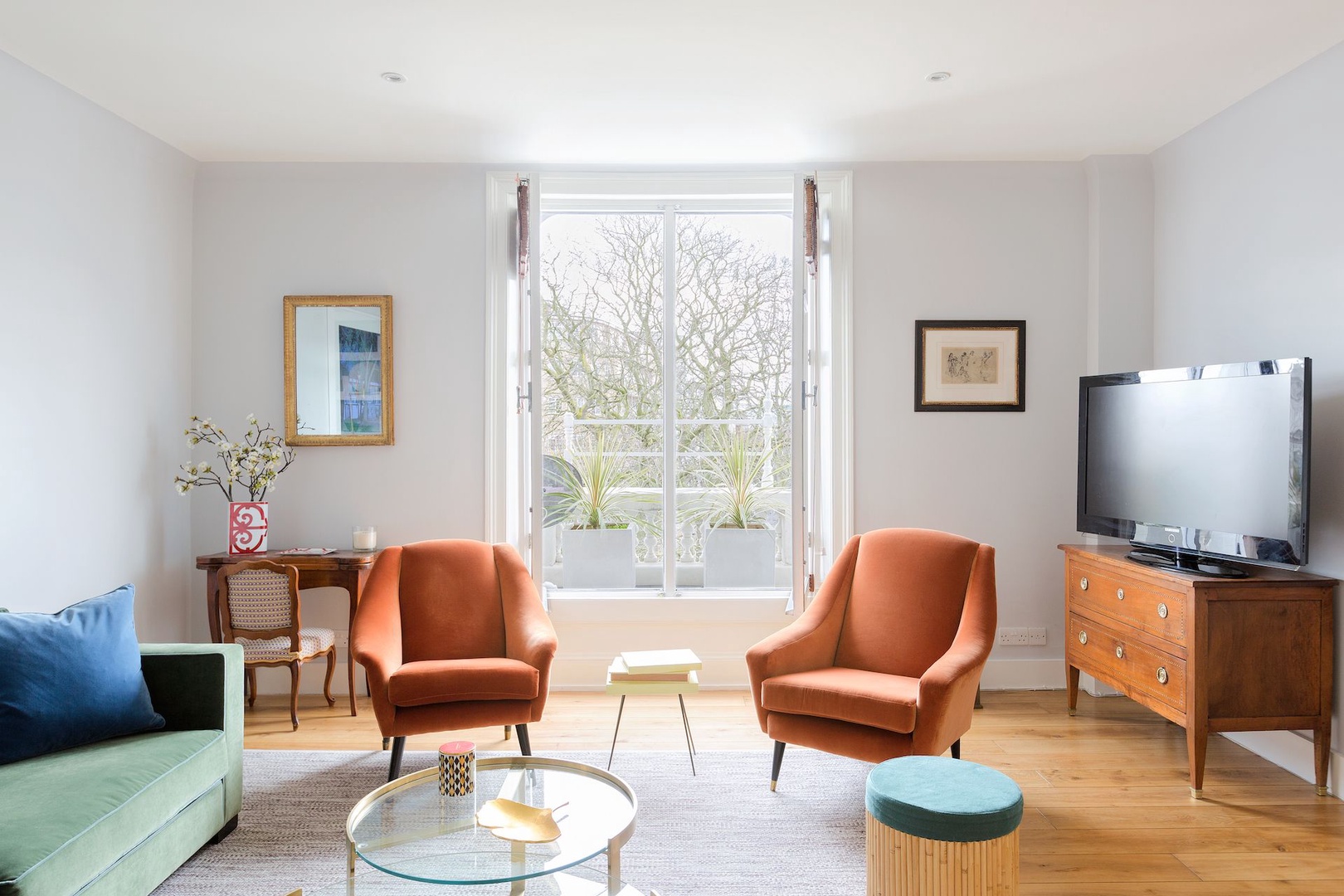 Natural light floods the living area from the large windows