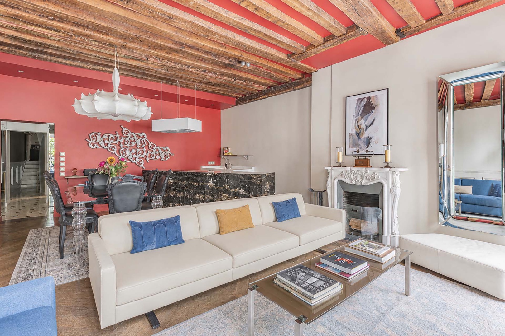 Creative wall art on the red wall doubles as a radiator in winter!