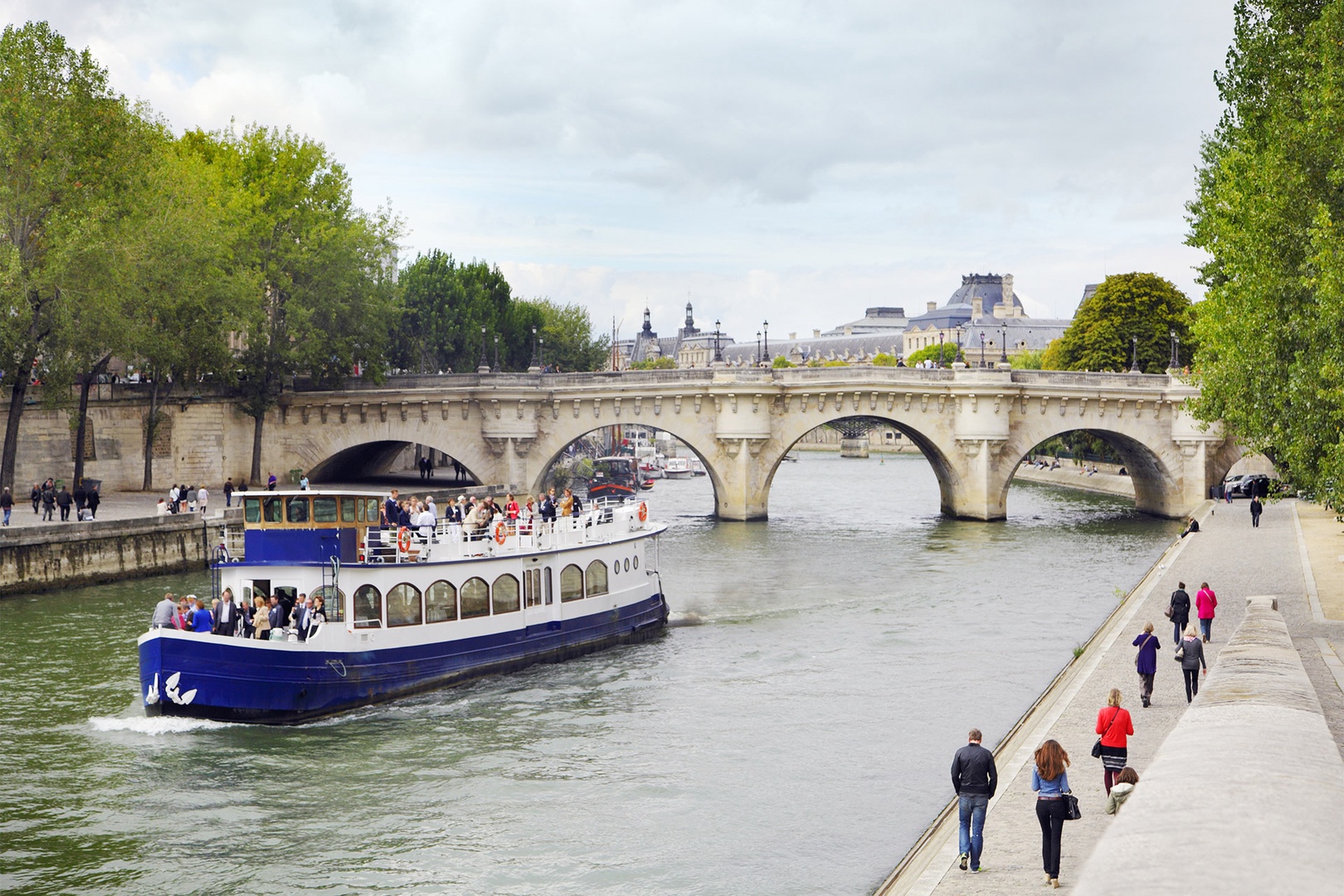 Book a Seine cruise or take a leisurely stroll along the Seine.