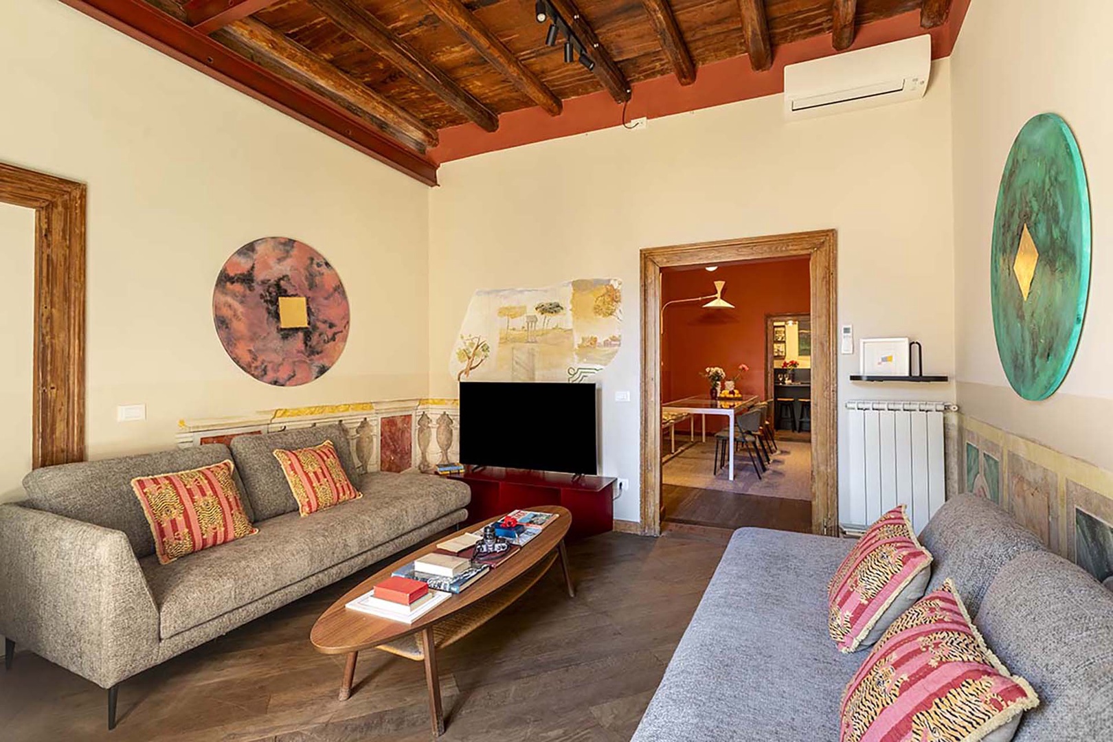 Living room opens to dining room with kitchen beyond.