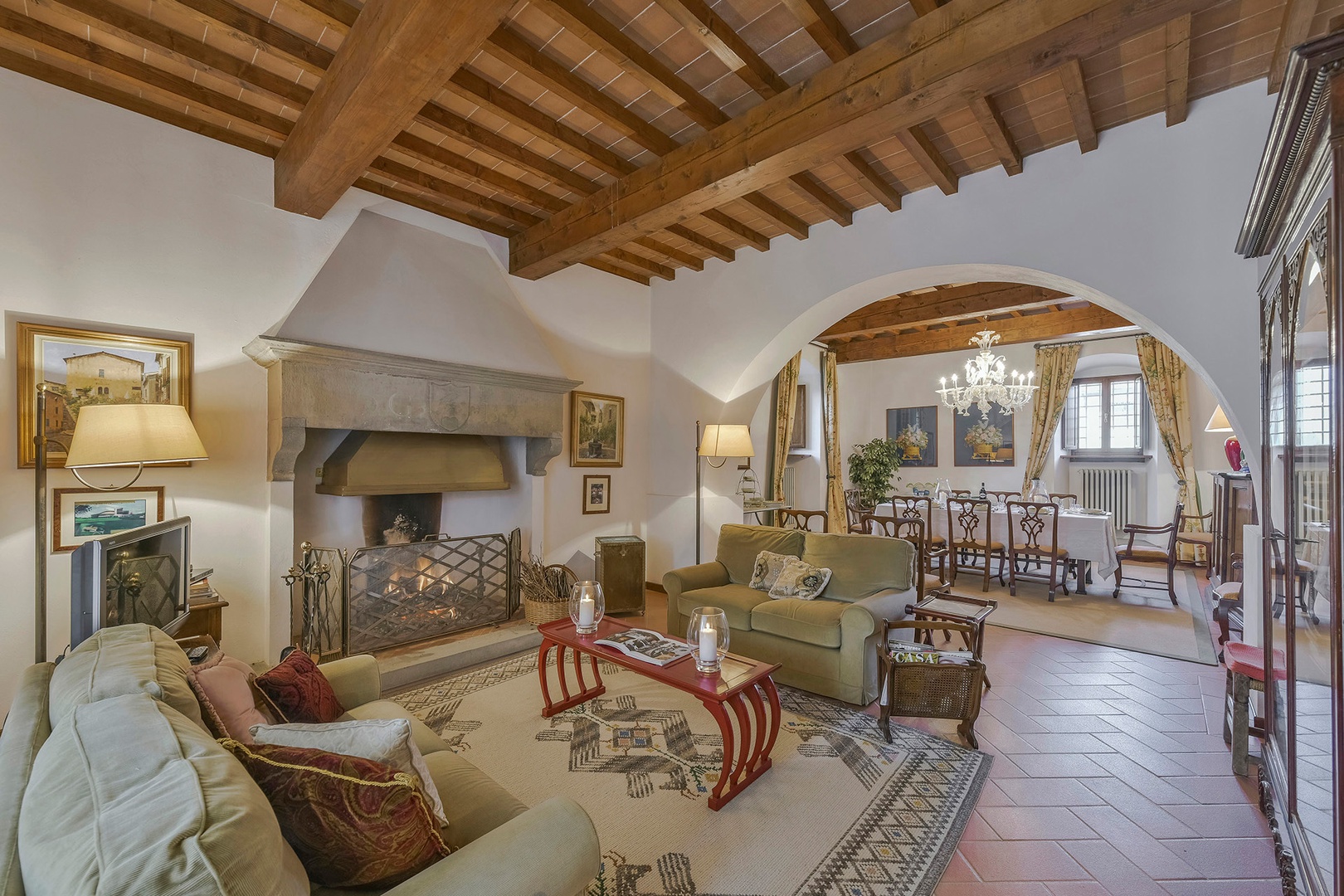 Comfortable and inviting living room with working fireplace.